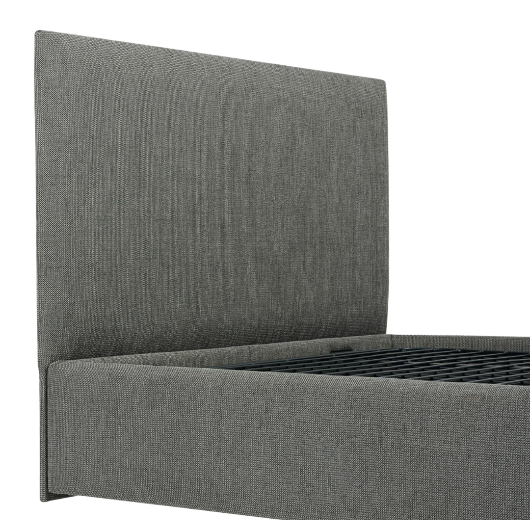 Icare Headboard mounted on an adjustable bed, featuring soft upholstery and pillow retention support for enhanced comfort and bedroom style.