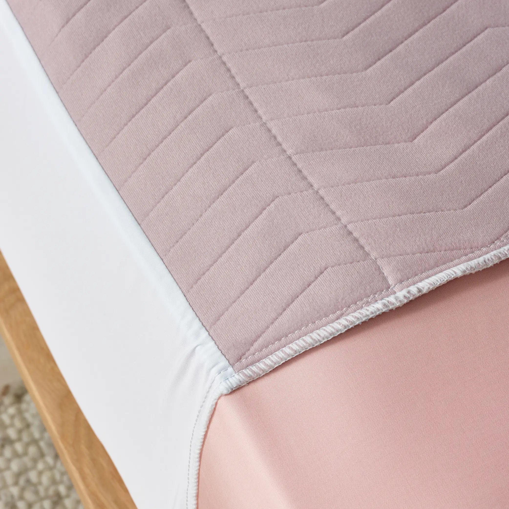Close-up of the Lilac waterproof bed, often referred to as Kylie bed pad showcasing soft quilted texture and leak-proof protection.