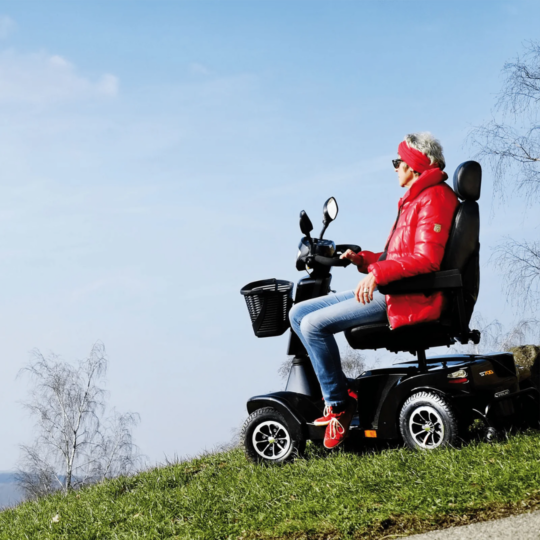 Sunrise Medical Sterling S700 Mobility Scooter in Silver with full suspension and large wheels for rugged outdoor use.