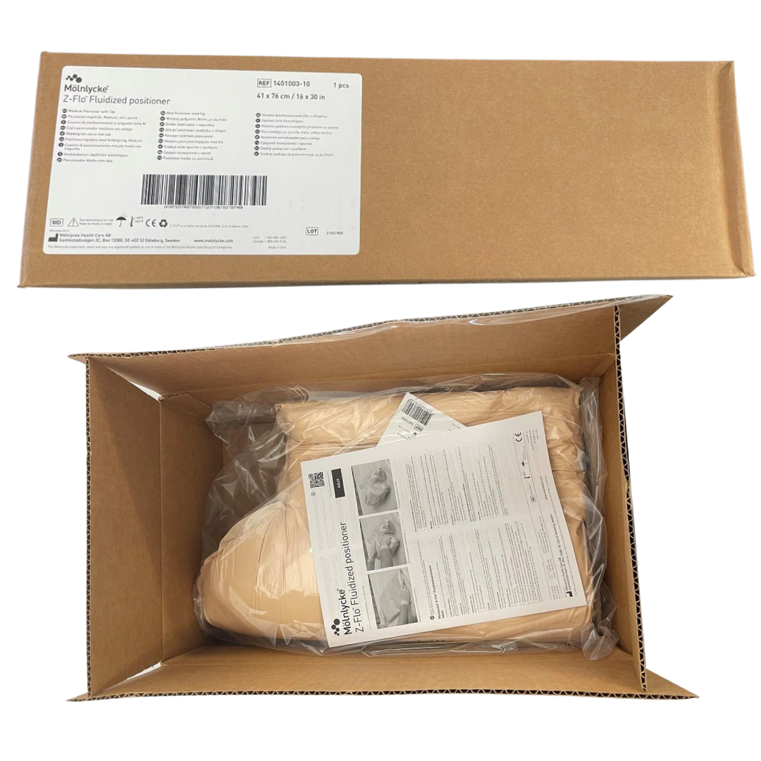 Mölnlycke Z-Flo Fluidized Positioner (REF 1401003-10) in original shipping box. Measures 41 x 76 cm / 16 x 30 in.