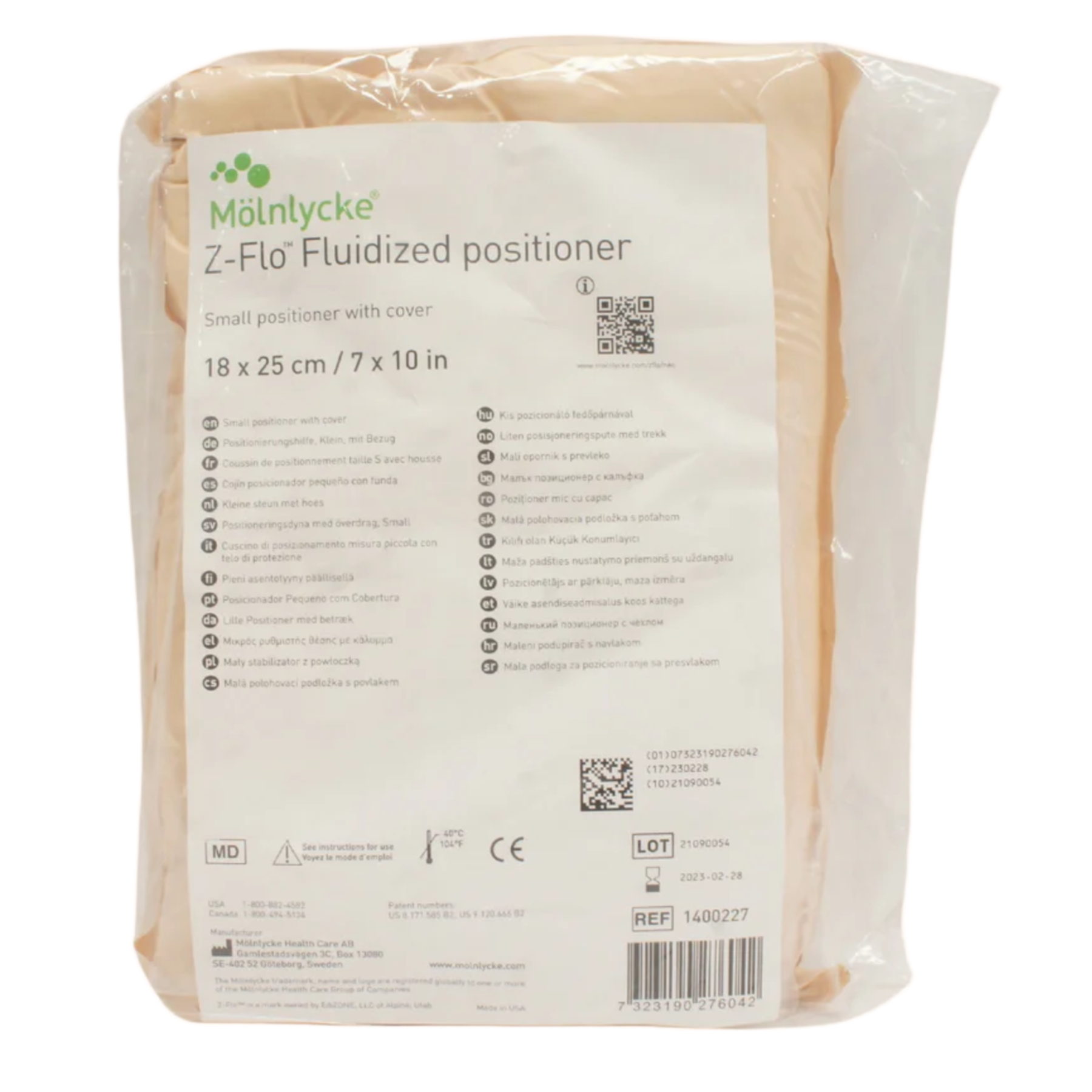 A small Mölnlycke Z-Flo Fluidized positioner, measuring $18 \times 25$ cm ($7 \times 10$ in), shown in its clear plastic packaging with a white product label.