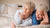 elderly couple happily lounging in their adjustable or hospital bed