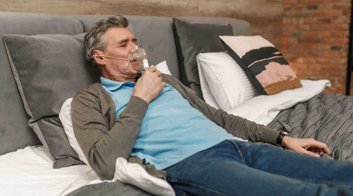 Happy and healthy senior man wearing cpap mask sleeping smoothly all night long