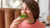 woman-restaurant-cozy-warm-sweater-wholesome-breakfast-with-toast-with-arugula-salmon