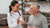 doctor showing older man a bottle of pills