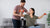 young-adult-helping-person on a wheelchair workout