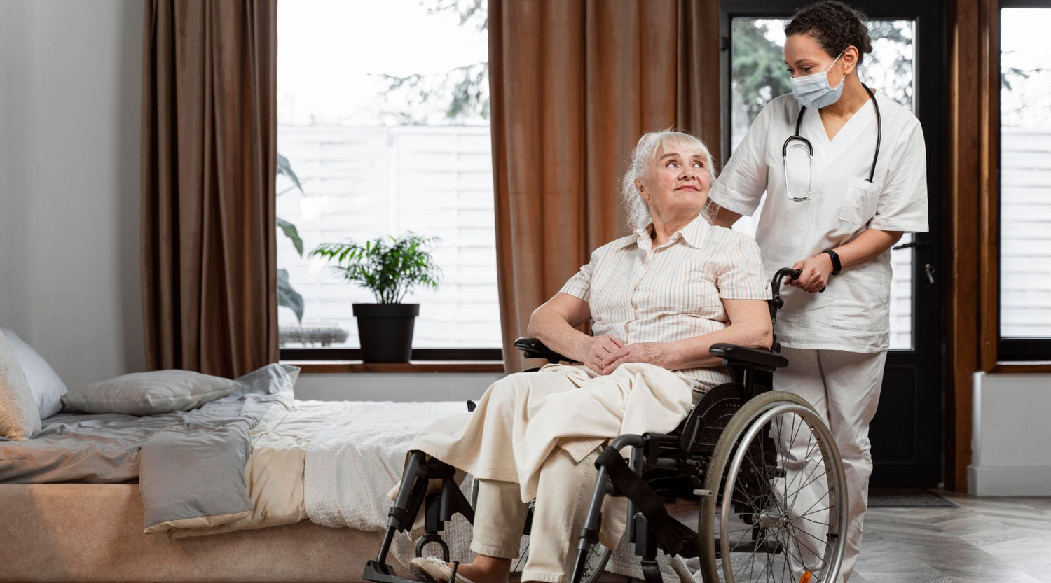 doctor after transferring someone from bed to wheelchair