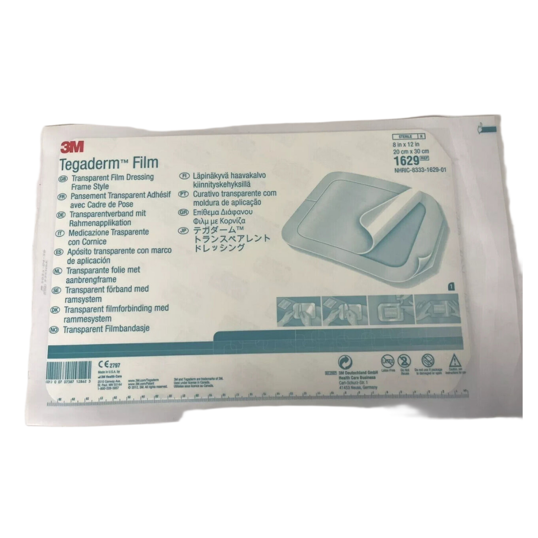 Close-up of 3M Tegaderm 1629 transparent film dressing 20x30cm individual sterile pack featuring multi-language instructions and frame style application.