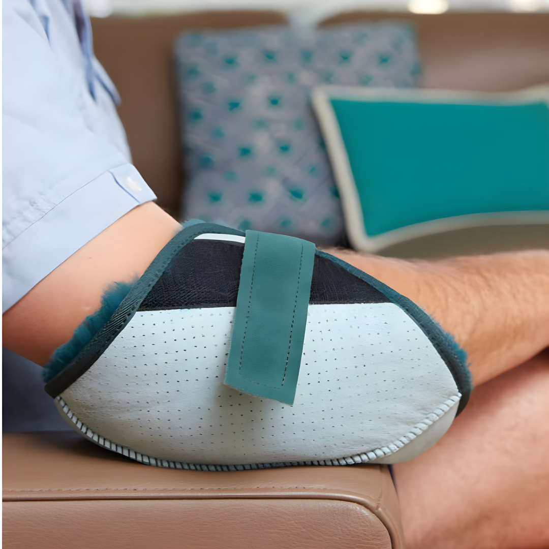 Soft sheepskin elbow protector providing comfort, breathability, and pressure relief for aged care and hospital patients.