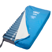 AirTec 8 Mattress Replacement System displayed on a bed frame, featuring deep air cells designed to deliver advanced alternating pressure relief for high‑risk users.