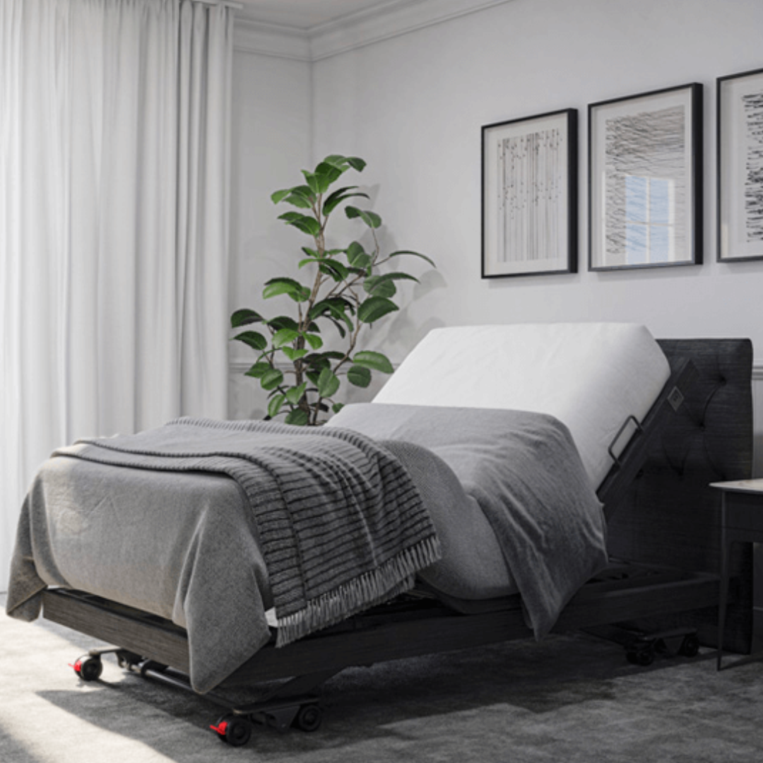 Aspire ComfiMotion Activ Care Ultra Low Bed in upholstered Portobello Grey with adjustable height and head support.