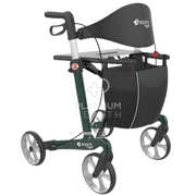 Aspire Vogue Carbon Fibre Seat Walker in Tall Emerald color with a black seat, green frame, and soft wheels, equipped with a cane holder and a small utility bag.