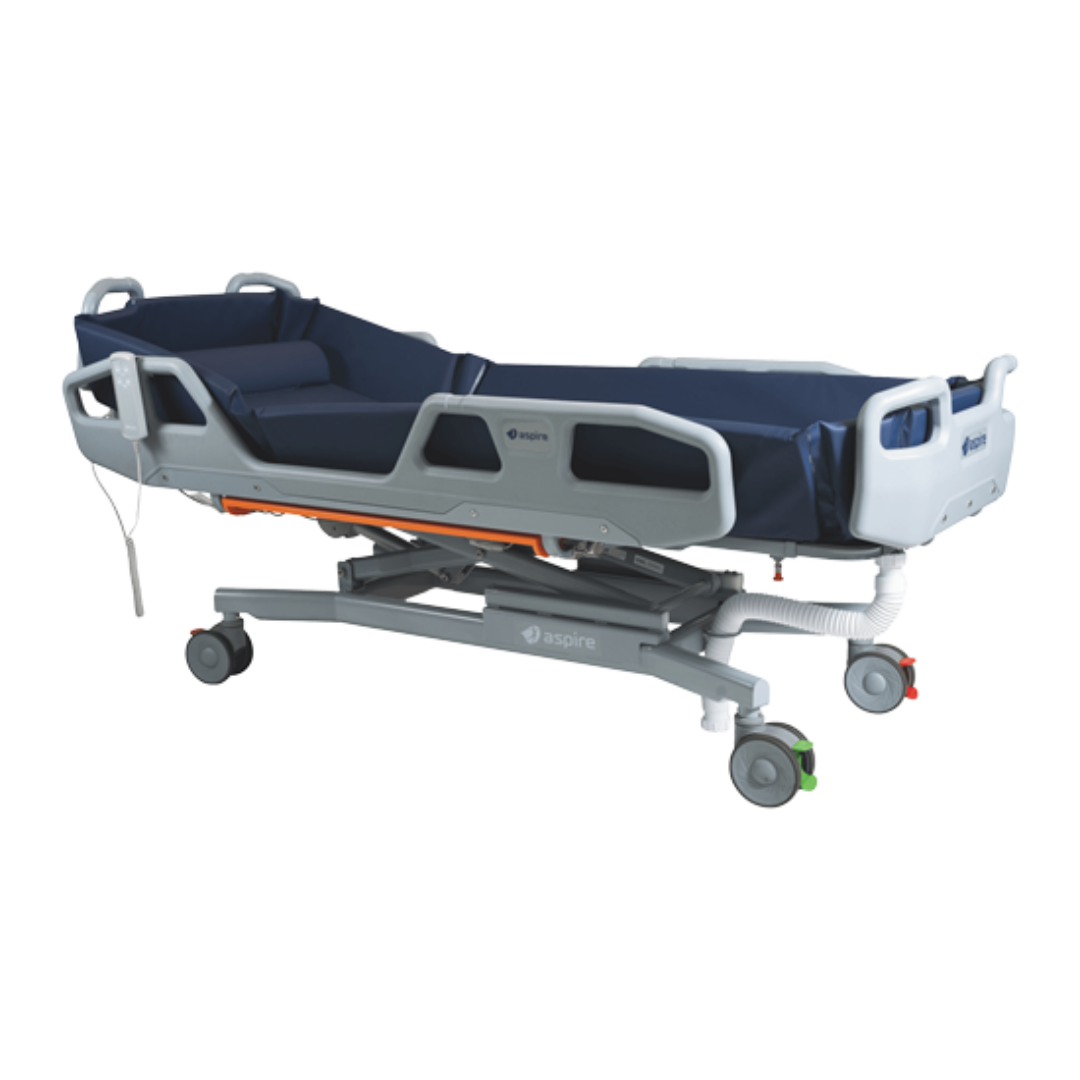Aspire Electric Shower Trolley with padded surface and adjustable height, designed for supported bathing in hospitals and aged care.