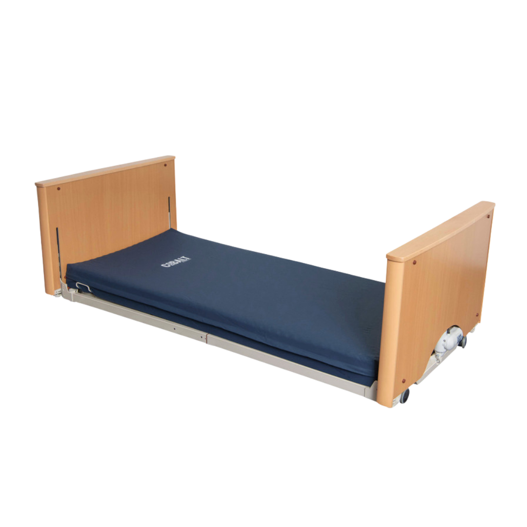 Cobalt Floor Line Bed with ultra-low height, electric adjustment, and safety features for aged care, hospital, and home care environments.