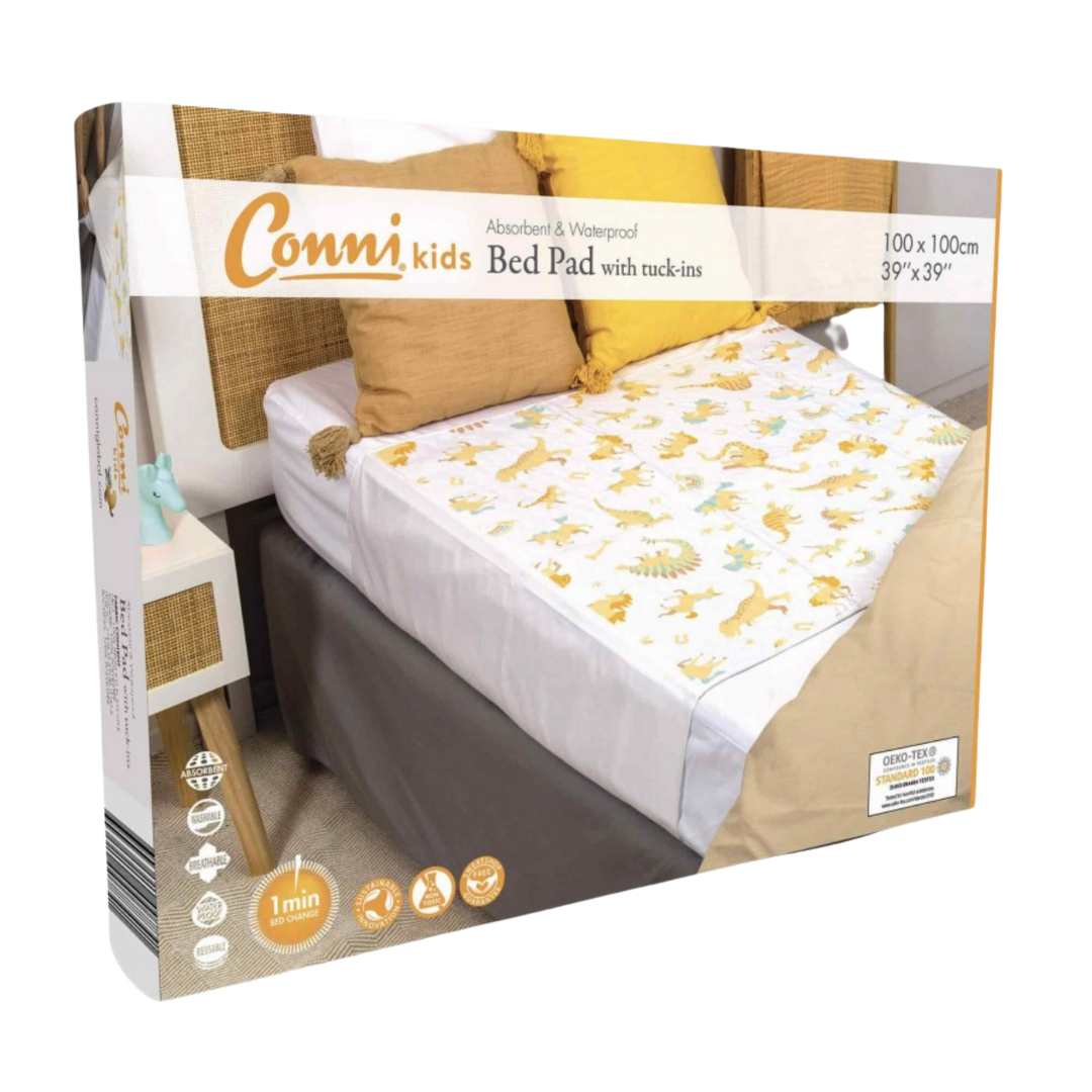 Conni Kids Bed Pad with tuck-ins, unicorn and dinosaur prints, reusable waterproof protection for children’s nighttime comfort and mattress safety.