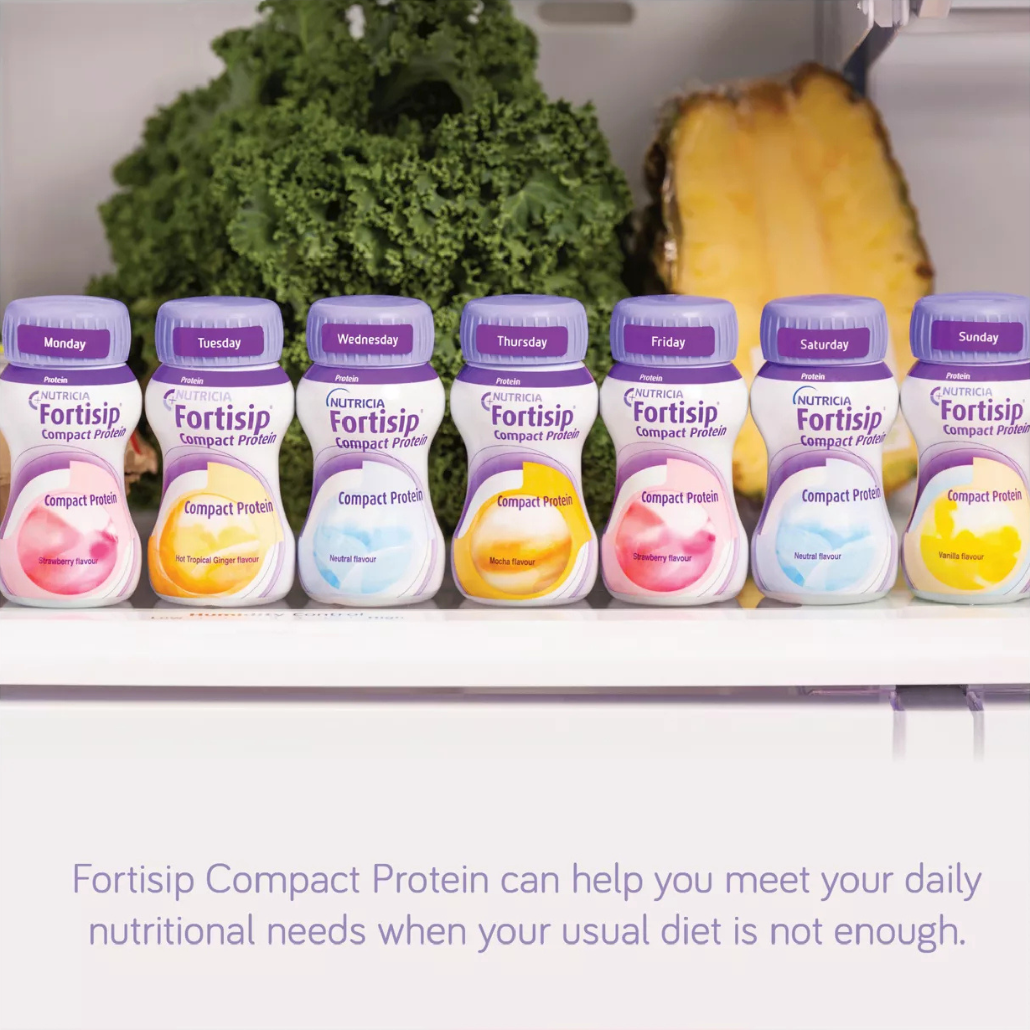 Row of Fortisip Compact Protein containers on a shelf with a pineapple and greens in the background.