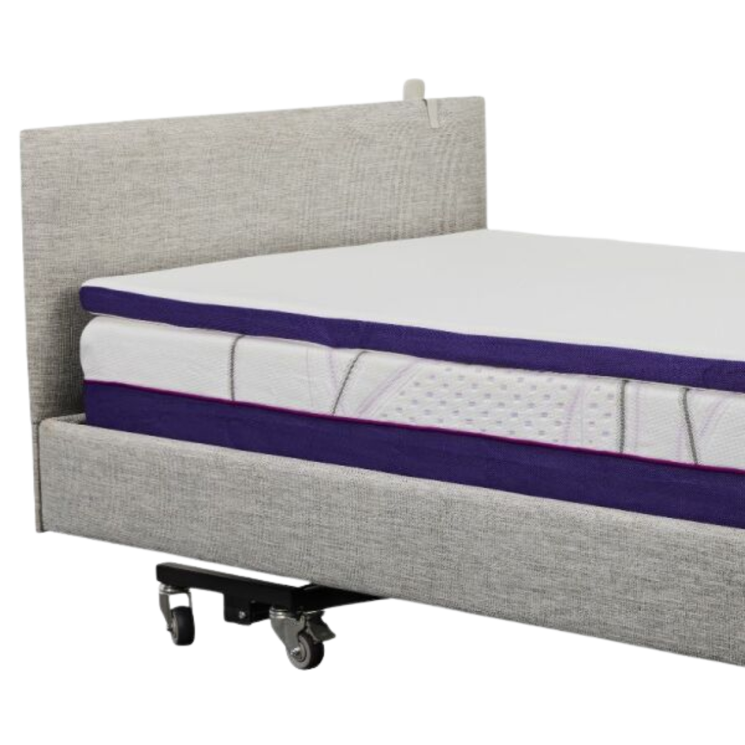 Icare Headboard mounted on an adjustable bed, featuring soft upholstery and pillow retention support for enhanced comfort and bedroom style.