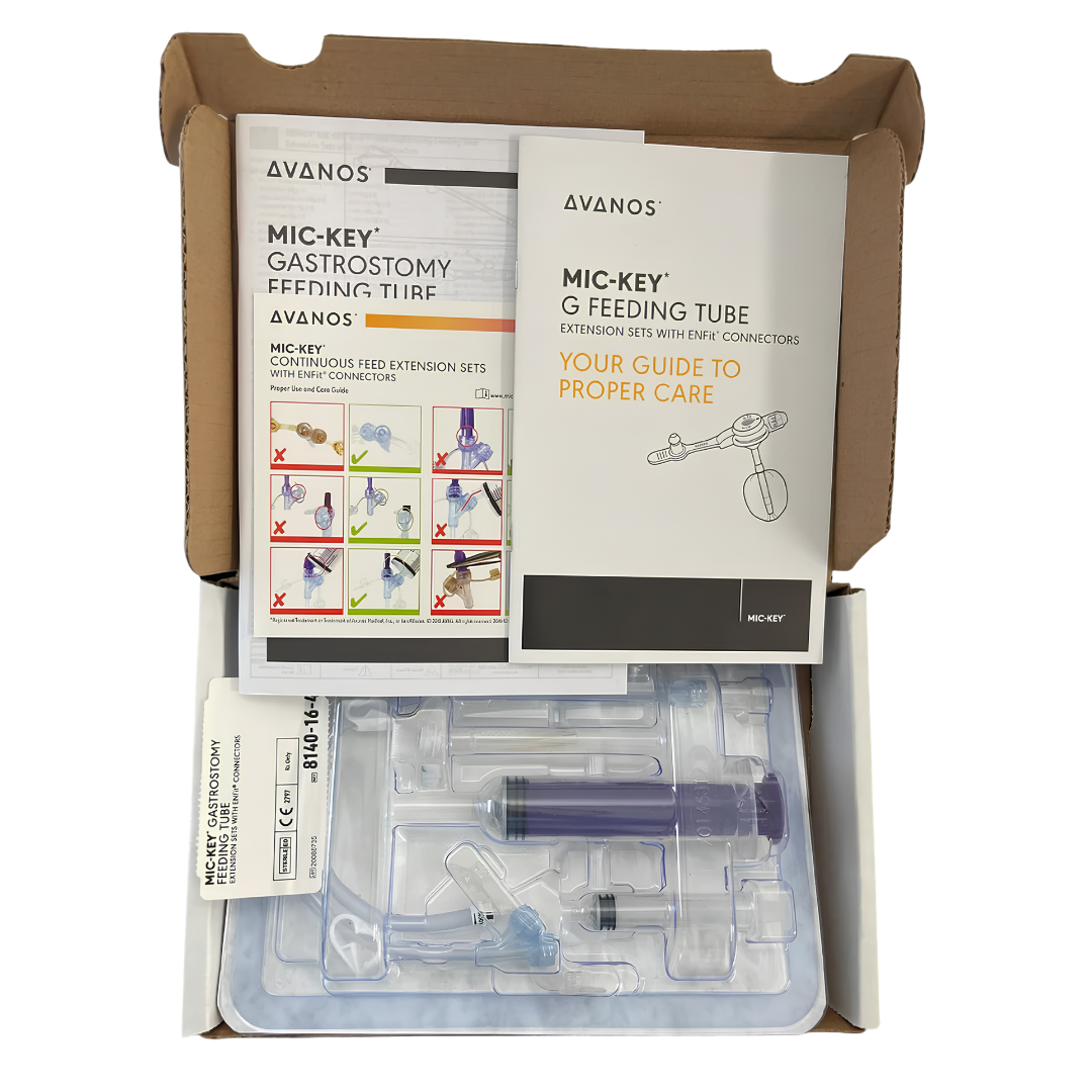 Mic-Key G 16 French low-profile balloon gastrostomy feeding tube with ENFit extension set, button-style feeding port with detachable extension tubing for enteral nutrition.