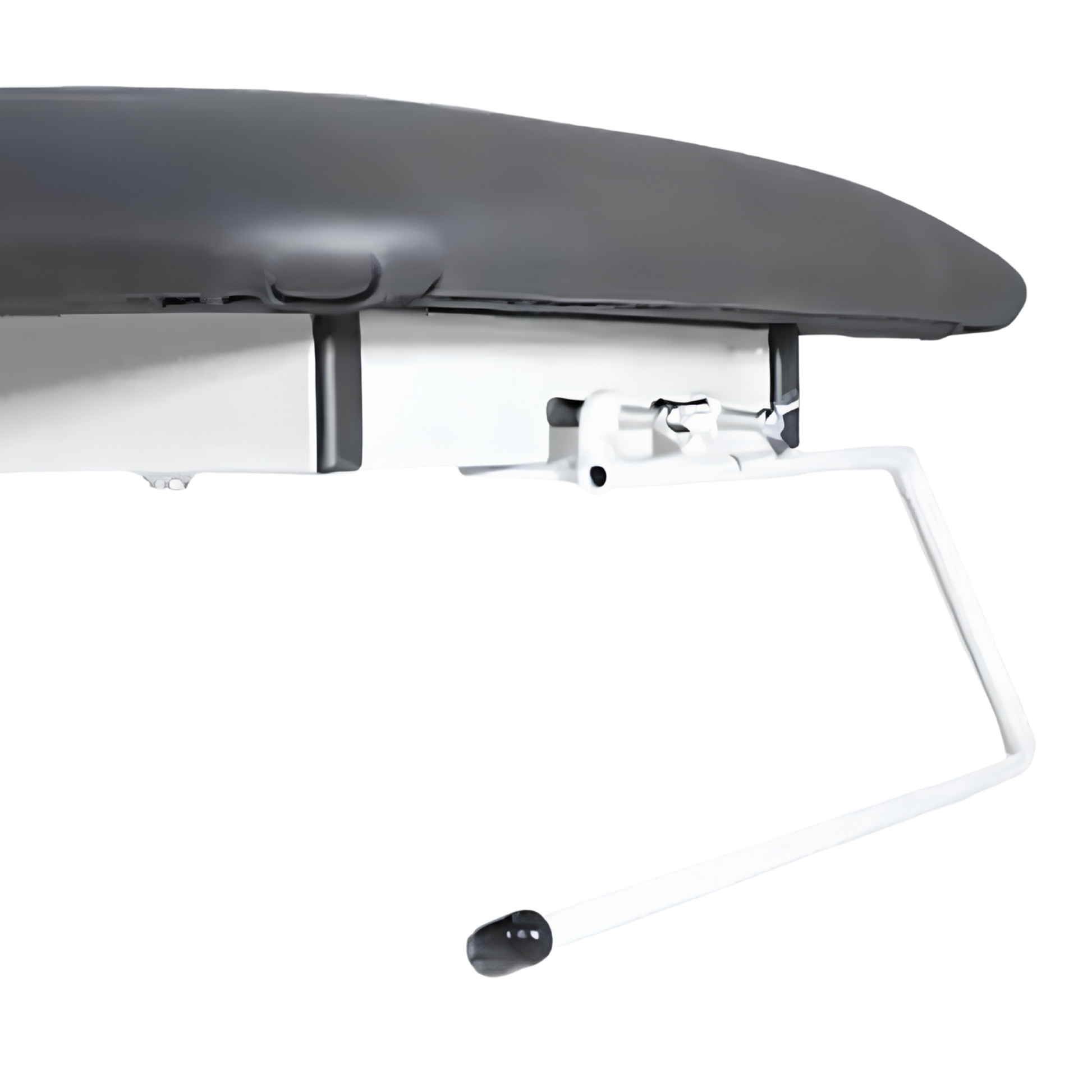 Close-up of a paper towel holder attachment mounted to the frame of a treatment couch.