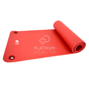 Red 15mm Pilates & Yoga Exercise Mat rolled up, highlighting its lightweight and portable design for easy transport and storage