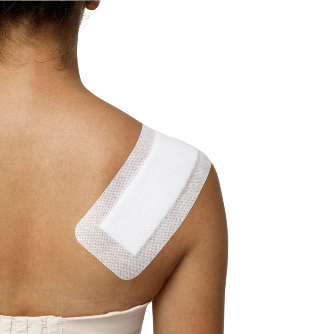Bodichek non-woven island dressing applied on shoulder area, showing secure fit with hypoallergenic adhesive and breathable material.
