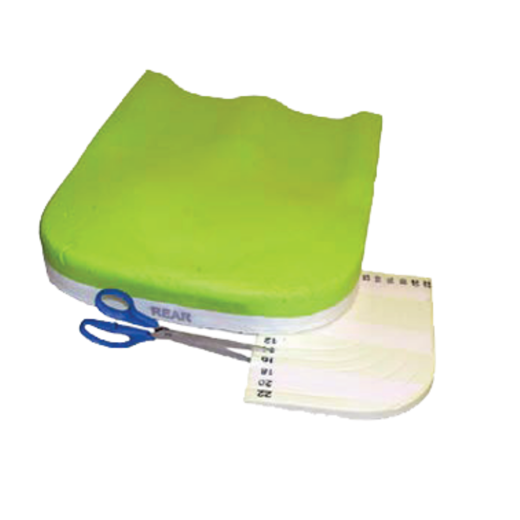 A lime green wheelchair cushion being customized with scissors, showing a measurement guide attached to the side for precise width and depth adjustments.