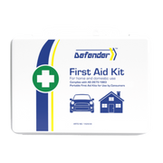A comprehensive flat-lay product image of the Defender 3 Series Waterproof First Aid Kit contents, arranged around the central white label. Contents include scissors, gauze, rolls of elastic or crepe bandage, surgical tape, ampoules, burn dressing packets, and an emergency thermal blanket, all for treating more serious injuries.