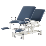 Professional Gynaecology treatment table with navy blue upholstery, featuring flat adjustable leg rests and an electric lift system.