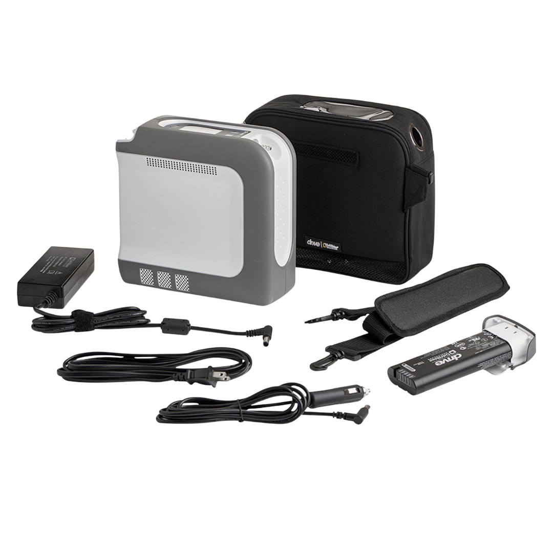Complete Drive DeVilbiss iGo2 Portable Oxygen Concentrator kit including concentrator, carry bag, battery, charger, and accessories.
