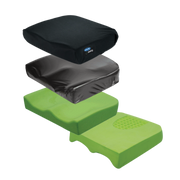 An exploded view showing the four layers of an Invacare Matrx wheelchair cushion, including the black outer cover, moisture-resistant inner cover, and two contoured foam base layers.