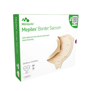 Product packaging for Mölnlycke Mepilex Border Sacrum, a self-adherent soft silicone multi-layer foam dressing, size 22x25 cm (8.7x9.8 in).
