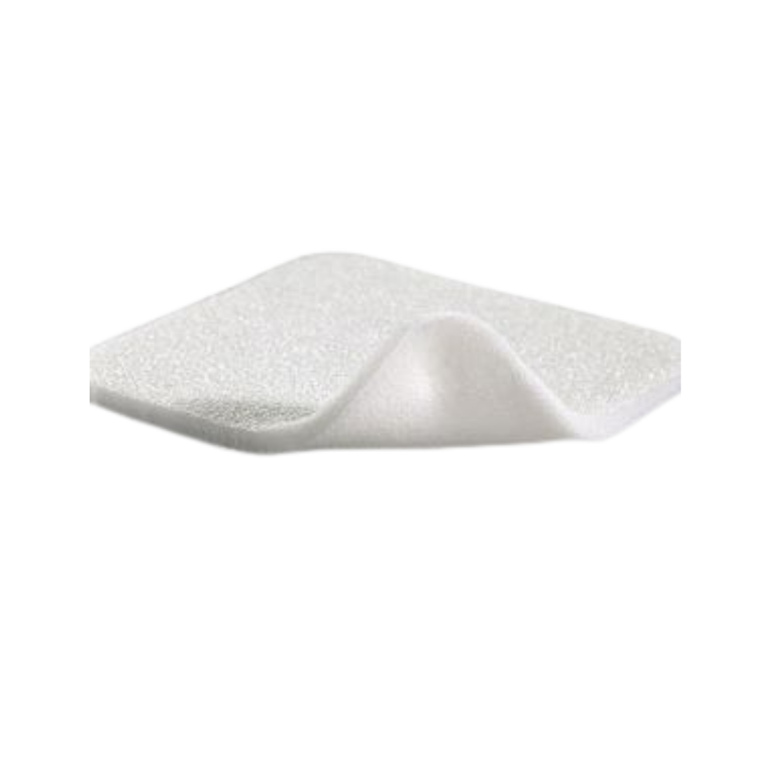 Close-up view of the white Mepilex foam dressing pad revealing the soft silicone layer and "Safetac Technology" label.