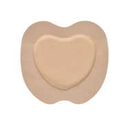 Close-up view of the beige, heart-shaped Osmocel Si Silicone Hydrophorous Foam - Sacral Bordered dressing.