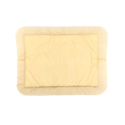 Close-up view of OsmoCel Si Silicone Hydroporous Foam dressing in a rectangular shape with rounded edges. The dressing features a soft beige silicone layer designed for gentle adhesion and effective wound care.
