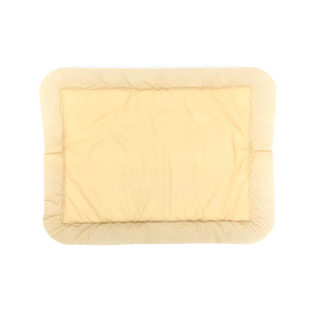 Close-up view of OsmoCel Si Silicone Hydroporous Foam dressing in a rectangular shape with rounded edges. The dressing features a soft beige silicone layer designed for gentle adhesion and effective wound care.
