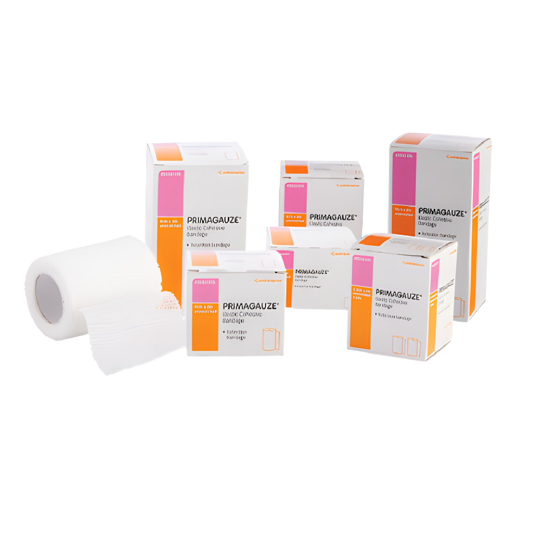 A group of Primagauze Elastic Cohesive Bandage boxes in various sizes with one white bandage roll displayed out of the box.