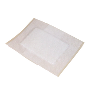 Close-up view of a single sterile-packaged Primapore Non-Woven Wound Dressing, showing the white absorbent pad centered on the breathable adhesive backing.