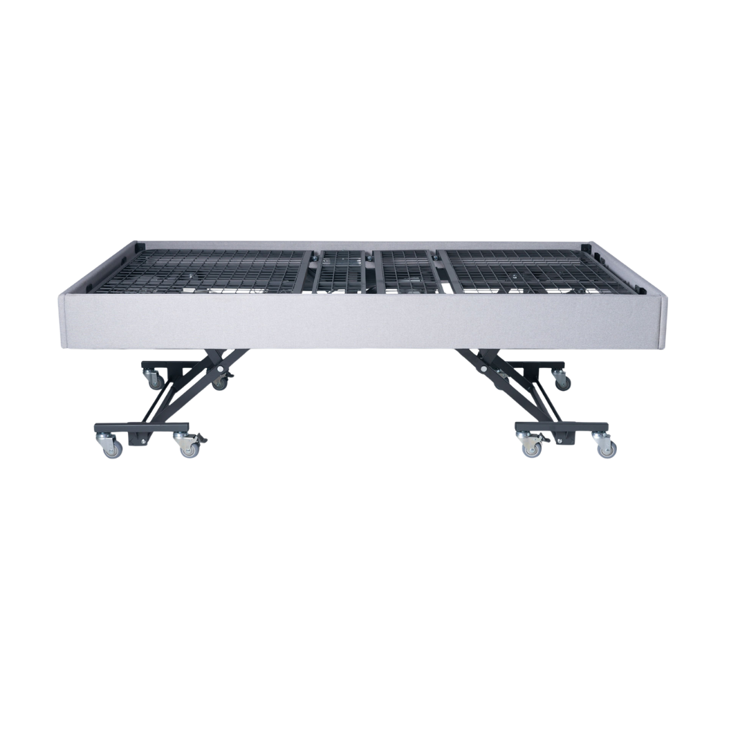 Royale Multi-Motion Bed in flat position with sturdy frame and smooth casters for easy mobility and patient care.
